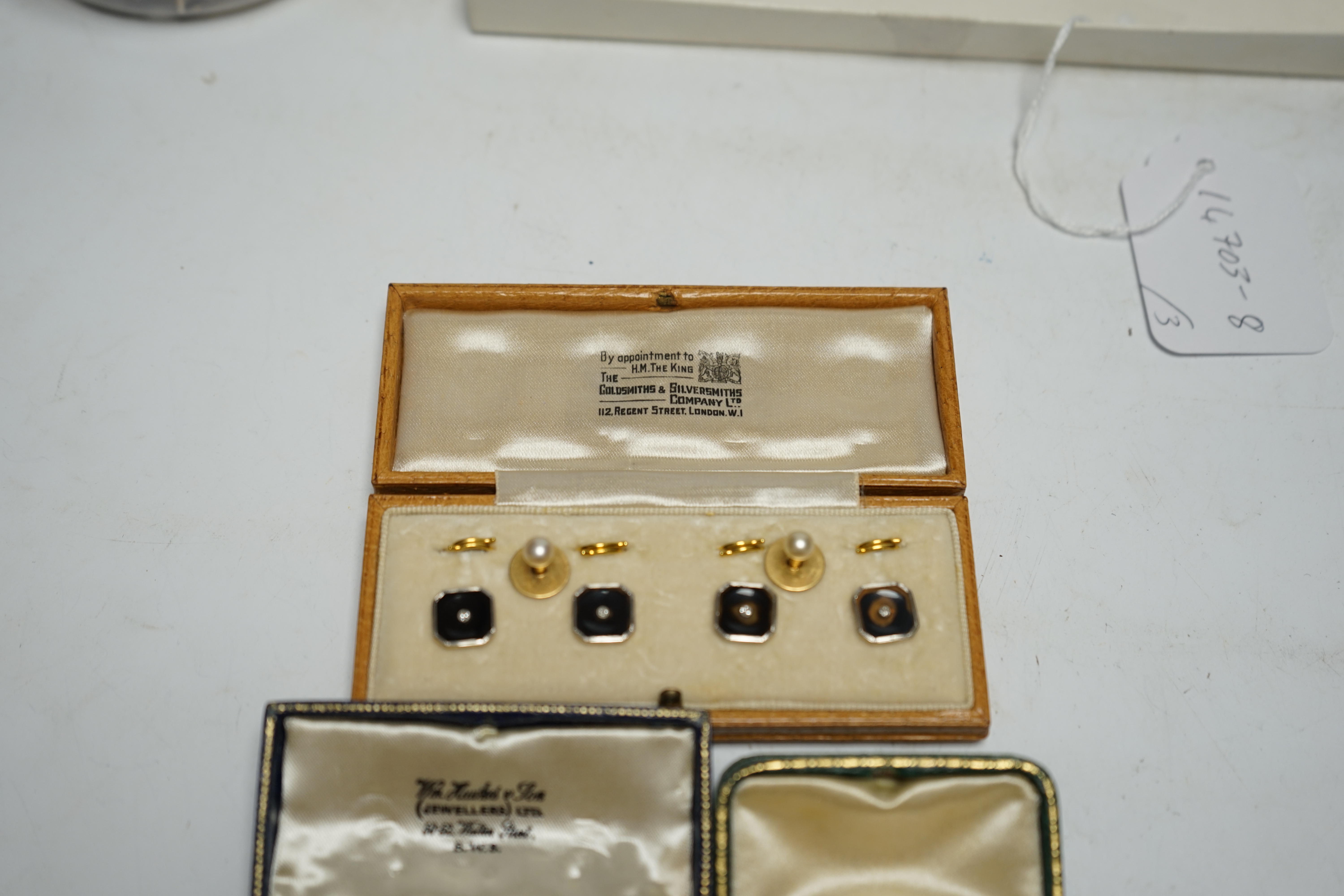 A cased set of four 18ct and plat. black onyx? and diamond set dress studs, two 18ct and cultured pearl set dress studs, four 9ct and plat. black onyx and seed pearl set dress studs and one other pair of 9ct and black on